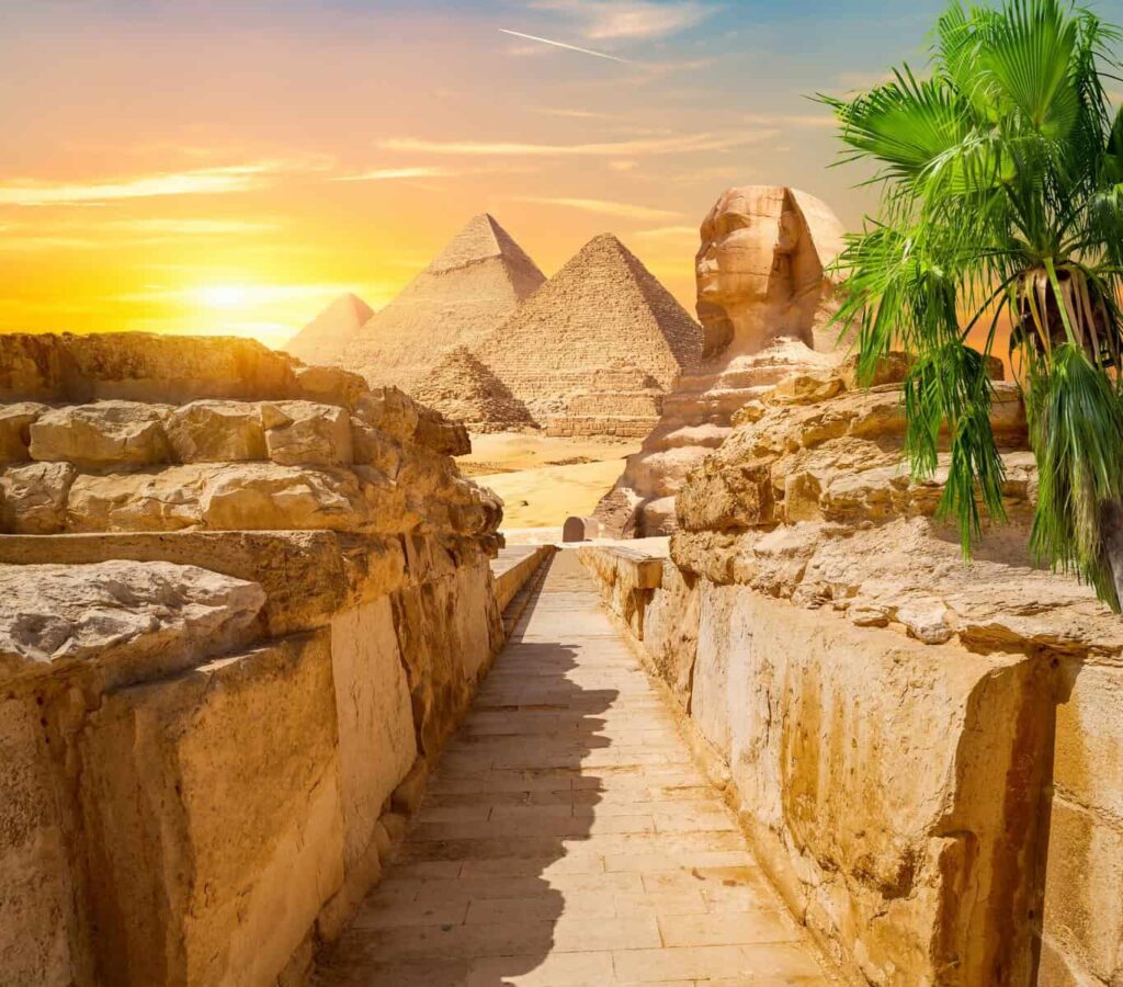 Pyramids and Great Sphinx at Giza in evening light