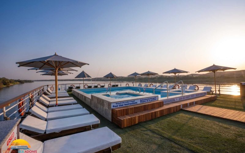 Sun deck with loungers, umbrellas and swimming pool aboard the M/S City & Sea Adonis.