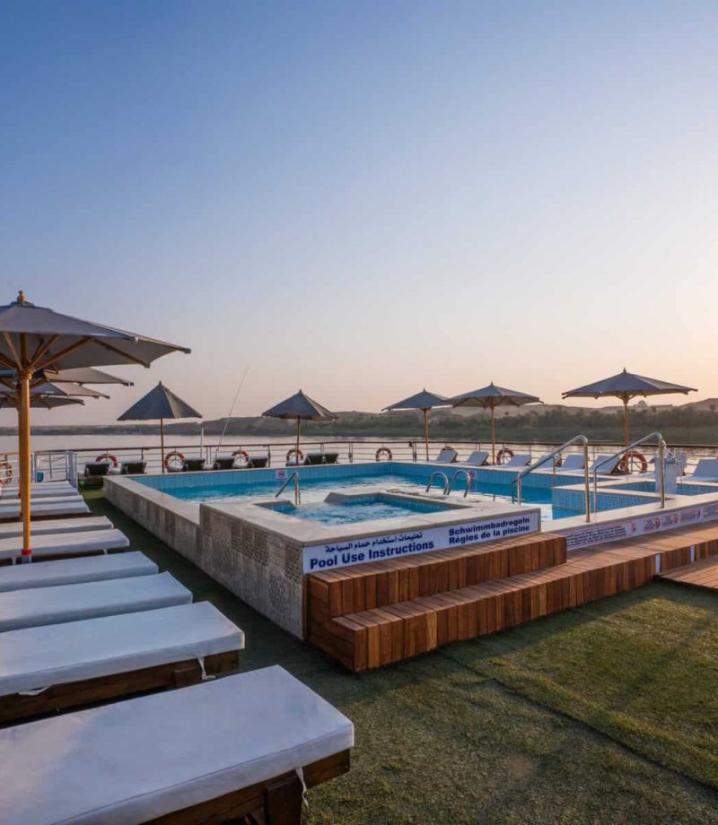 Sun deck with loungers, umbrellas and swimming pool aboard the M/S City & Sea Adonis.