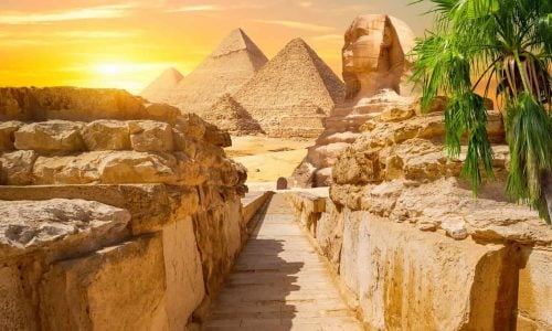 Evening sunshine over pyramids and Sphinx in Giza