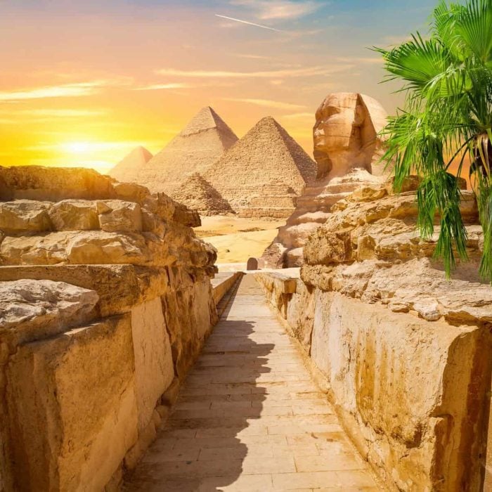 Evening sunshine over pyramids and Sphinx in Giza